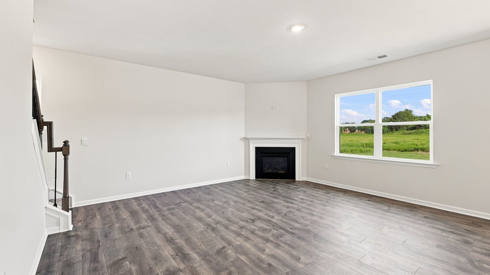 Living area with windows and fireplace.
