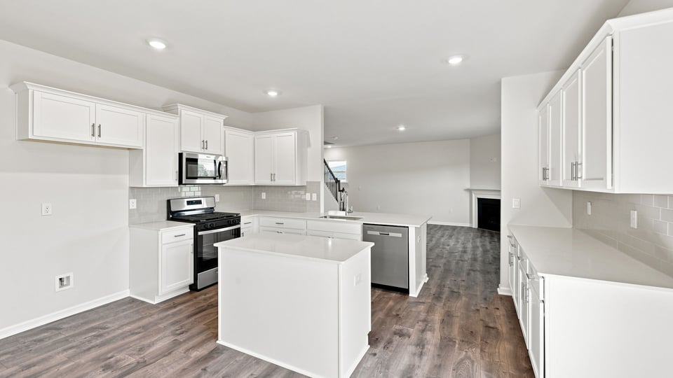 Kitchen with island and cabinets.