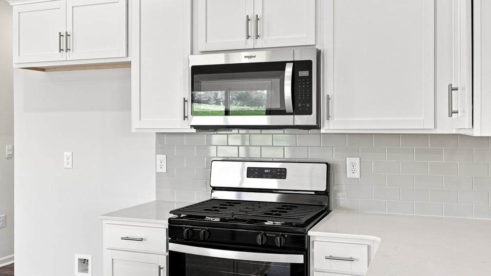 Kitchen with island and cabinets.