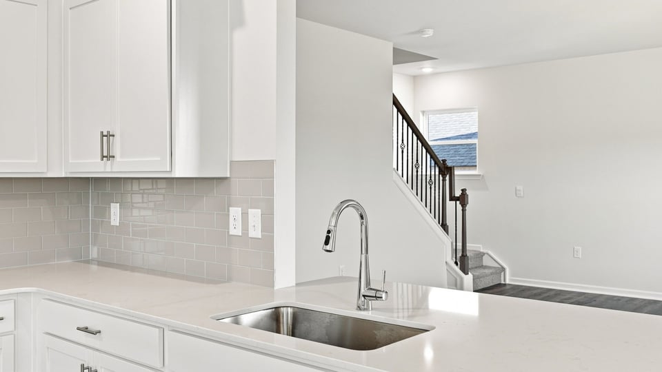 Kitchen with island and cabinets.