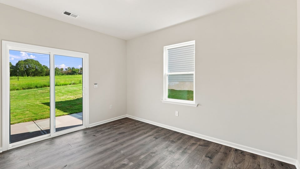 Living area with windows and fireplace.