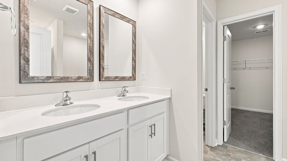 Primary bathroom with double vanity sinks.