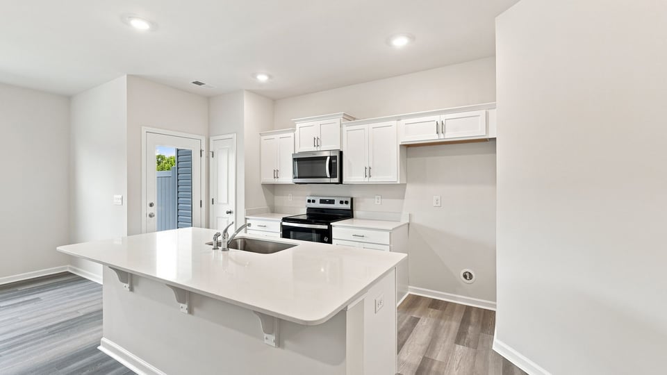Kitchen with stainless steel appliances.