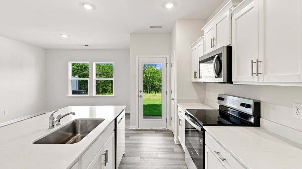 Kitchen with stainless steel appliances.