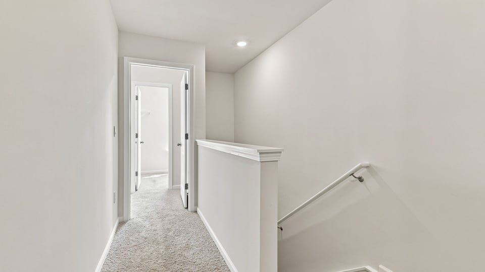Hallway view of bedrooms.