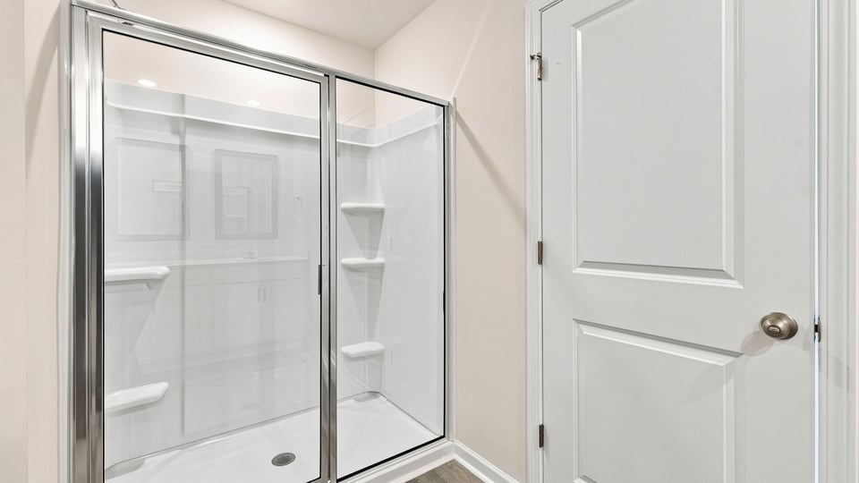 Bathroom with walk in shower.