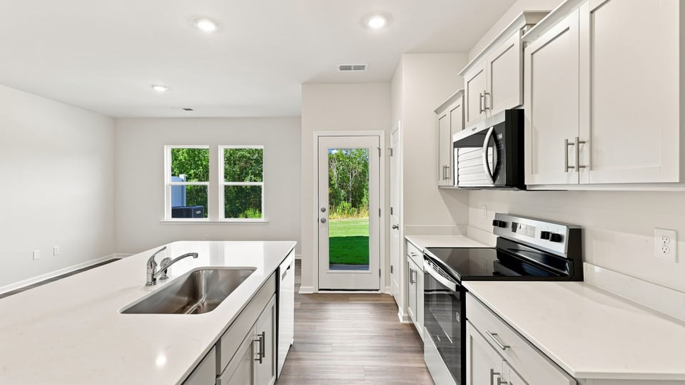 Kitchen with stainless steel appliances.