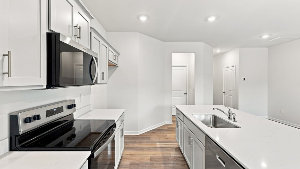 Kitchen with stainless steel appliances.