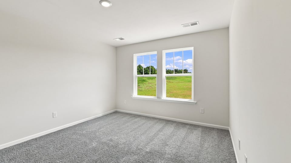 Bedroom with carpet.