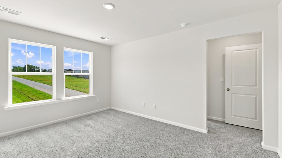 Bedroom with carpet.