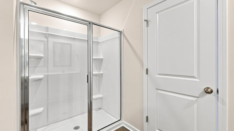 Bathroom with walk in shower.