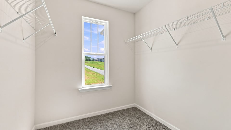 Closet with hanging storage racks.