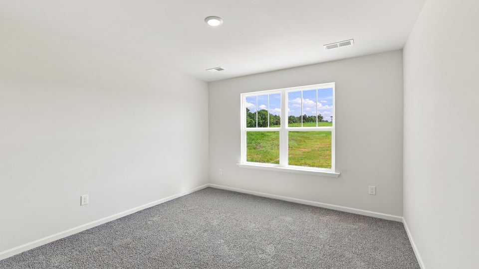 Bedroom with carpet.