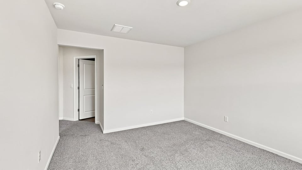 Bedroom with carpet.