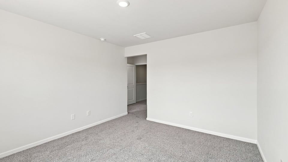 Bedroom with carpet.