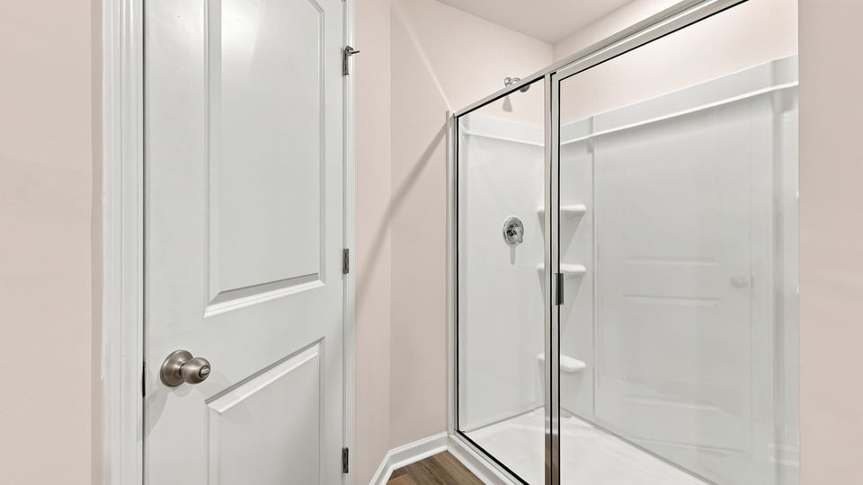 Bathroom with walk in shower.