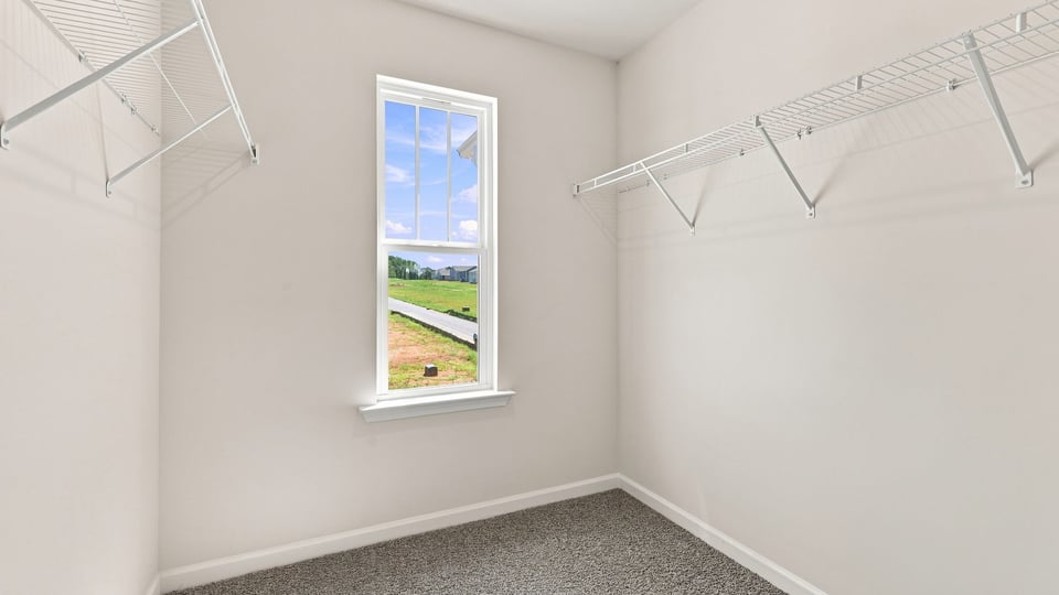 Closet with hanging storage racks.