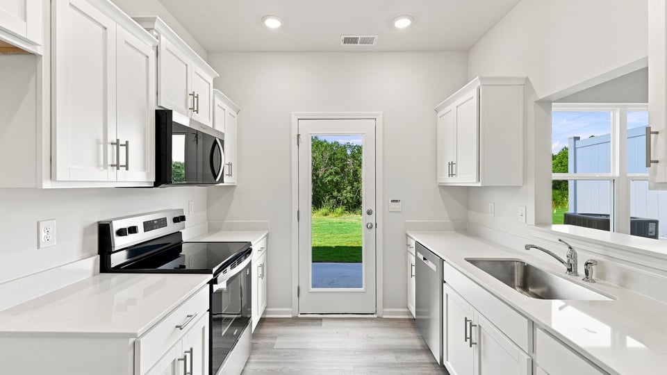 Kitchen with stainless steel appliances.