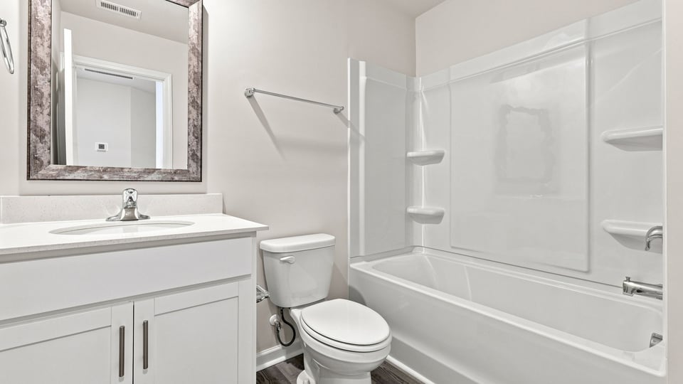 Bedroom with caarpet and window.