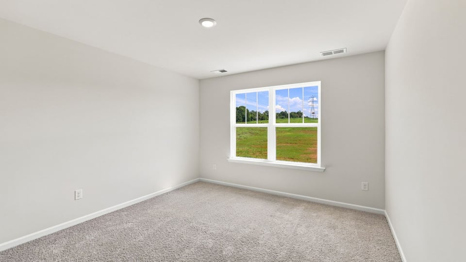 Bedroom with carpet.