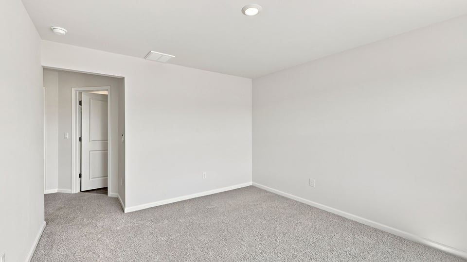 Bedroom with carpet.