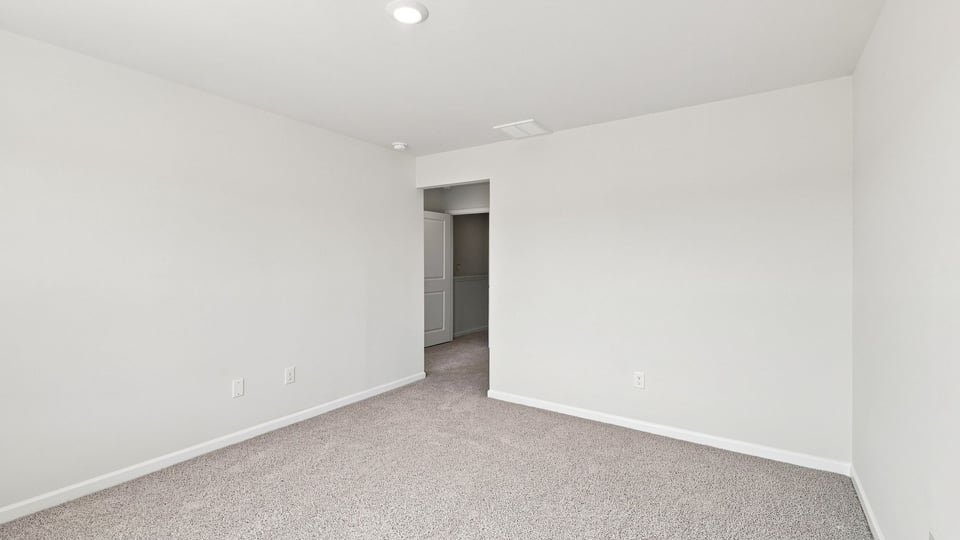 Bedroom with carpet.