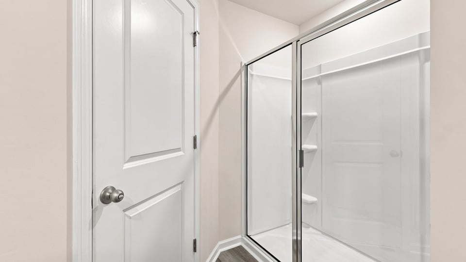 Bathroom with walk in shower.