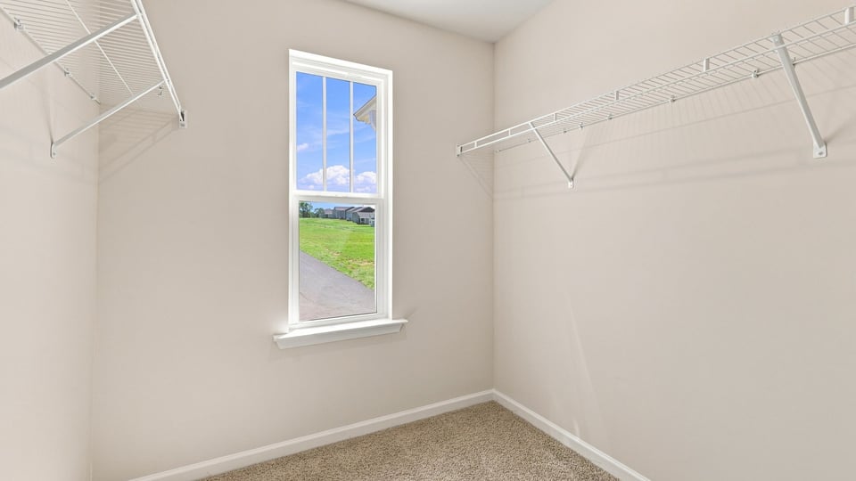 Closet with hanging storage racks.