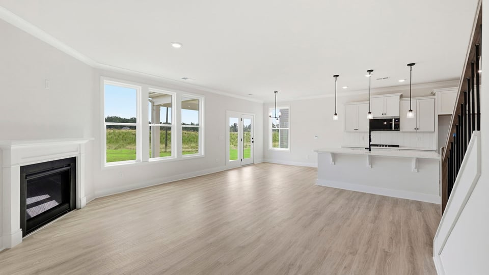 Living room with windows and fireplace.