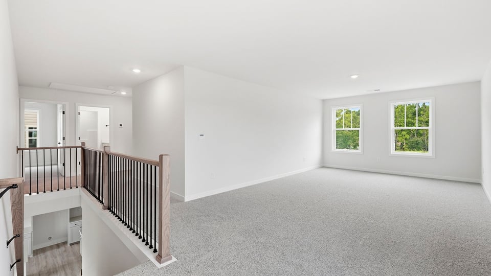 Loft area with carpet.