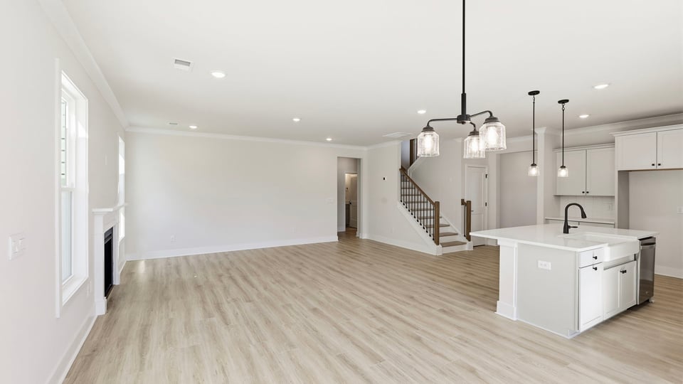 Kitchen and island with quartz countertops.