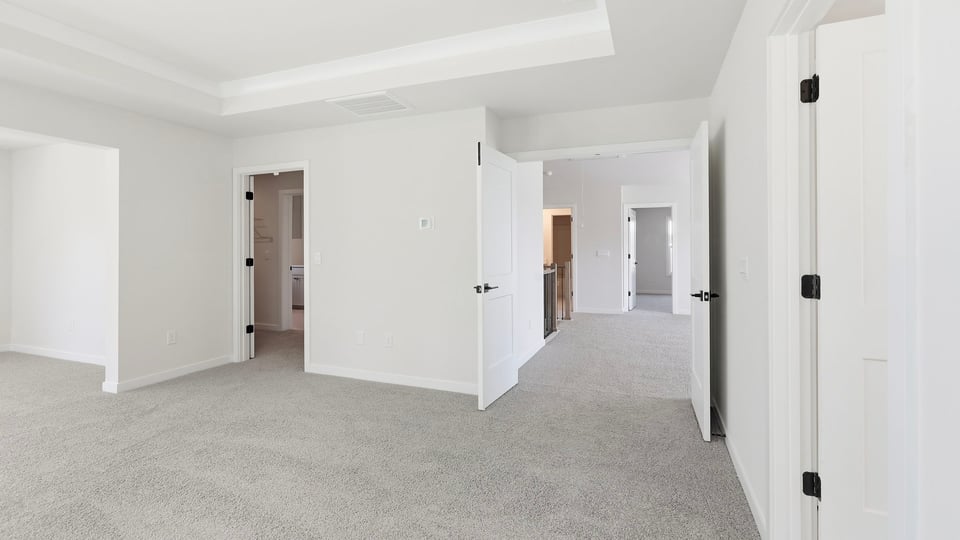 Bedroom with carpet and window.
