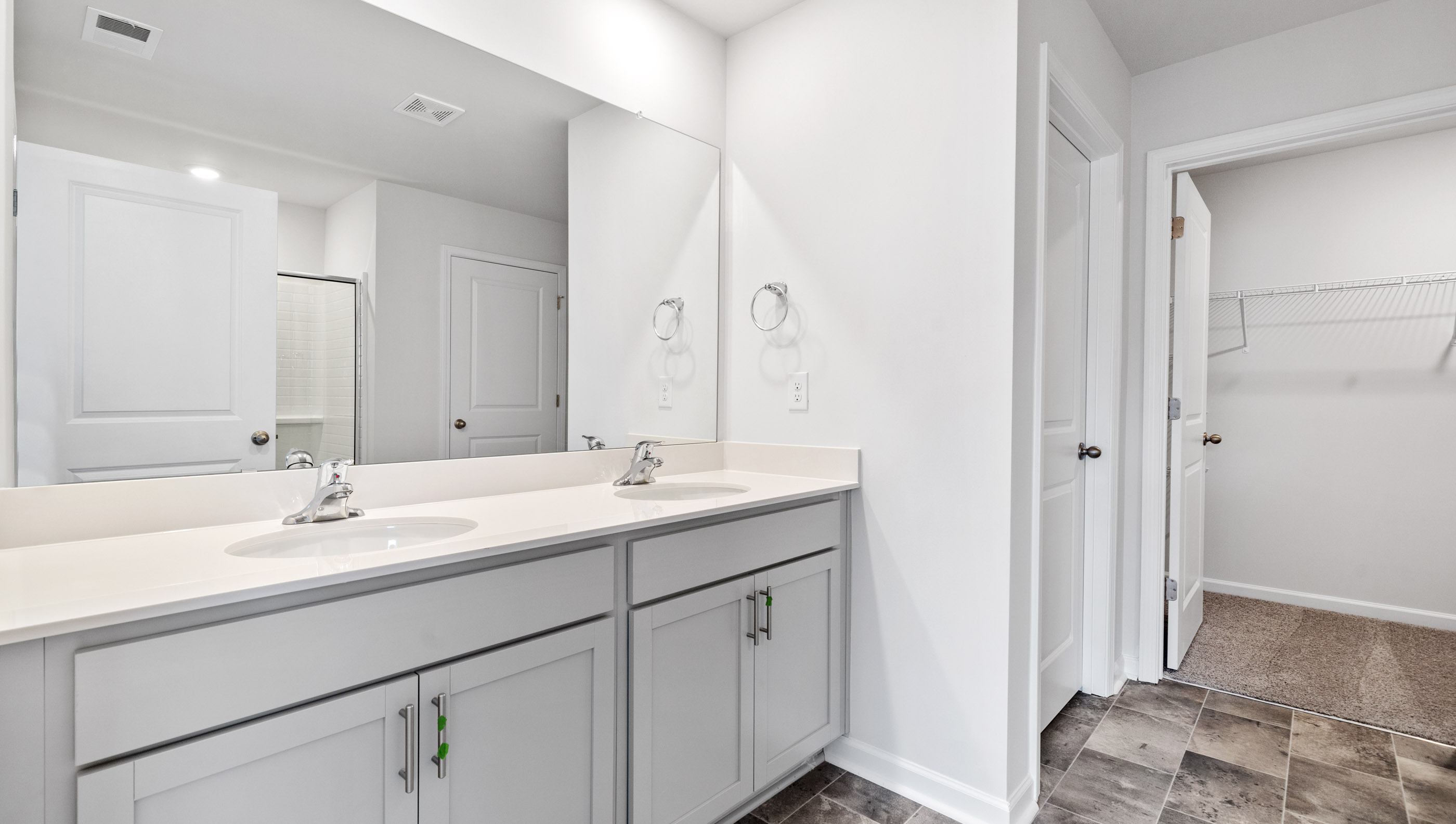Bathroom with vanity sinks.