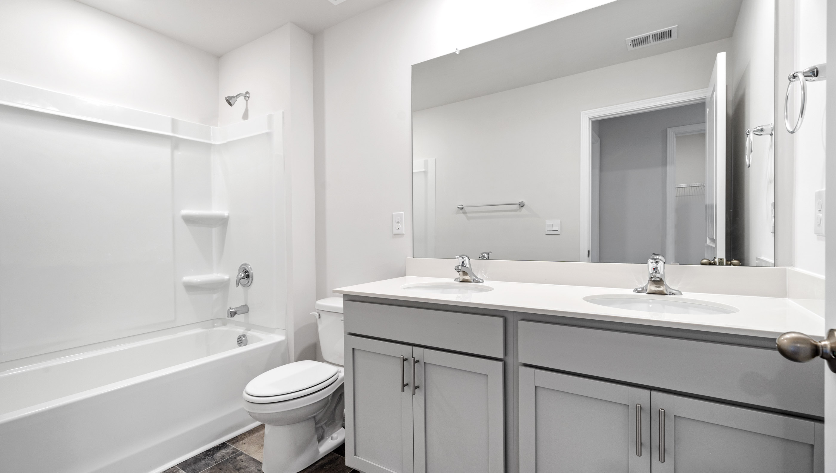 Bathroom with vanity sinks.
