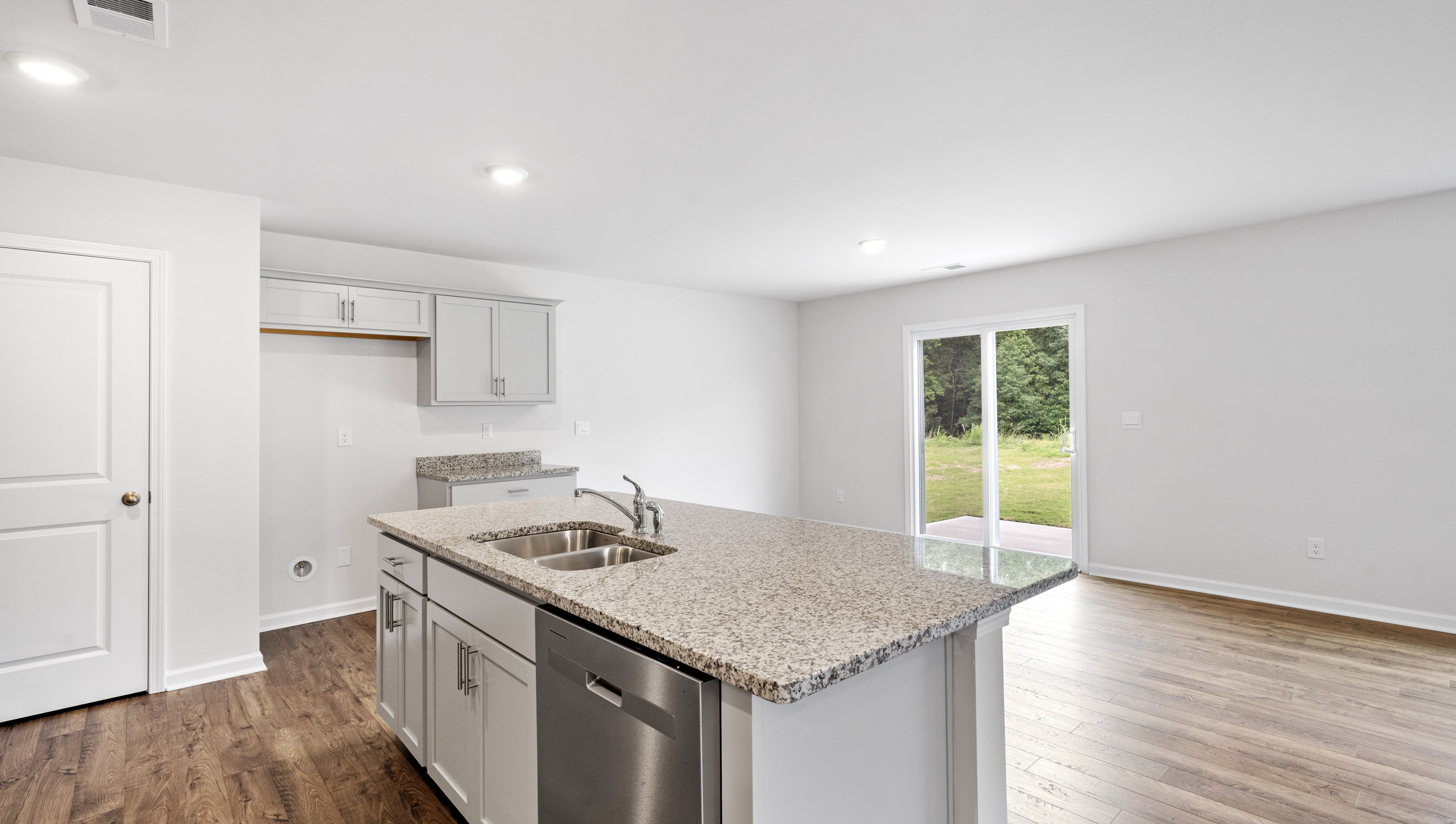 Kitchen with island and cabinets.
