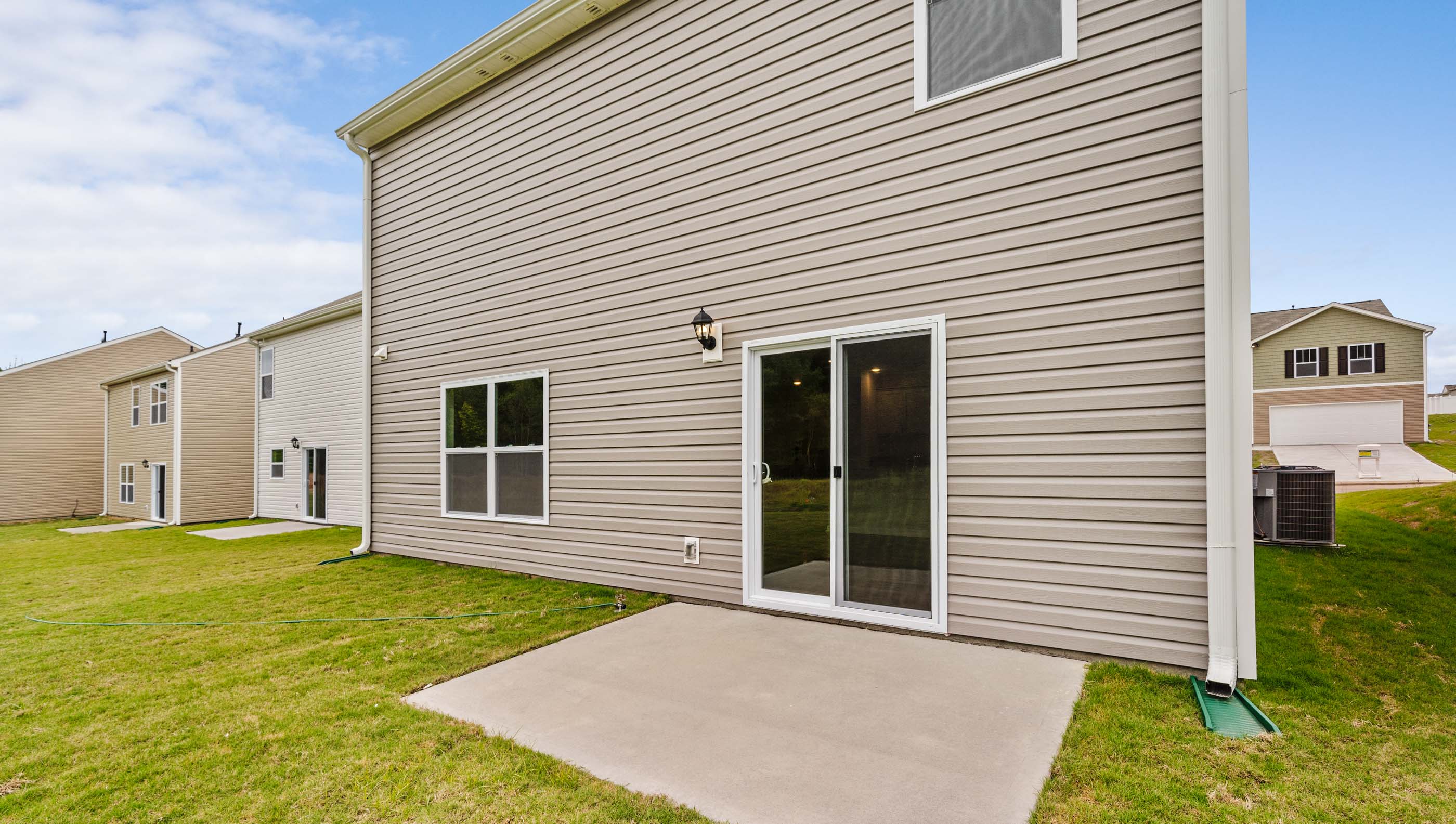 Back exterior with large backyard.