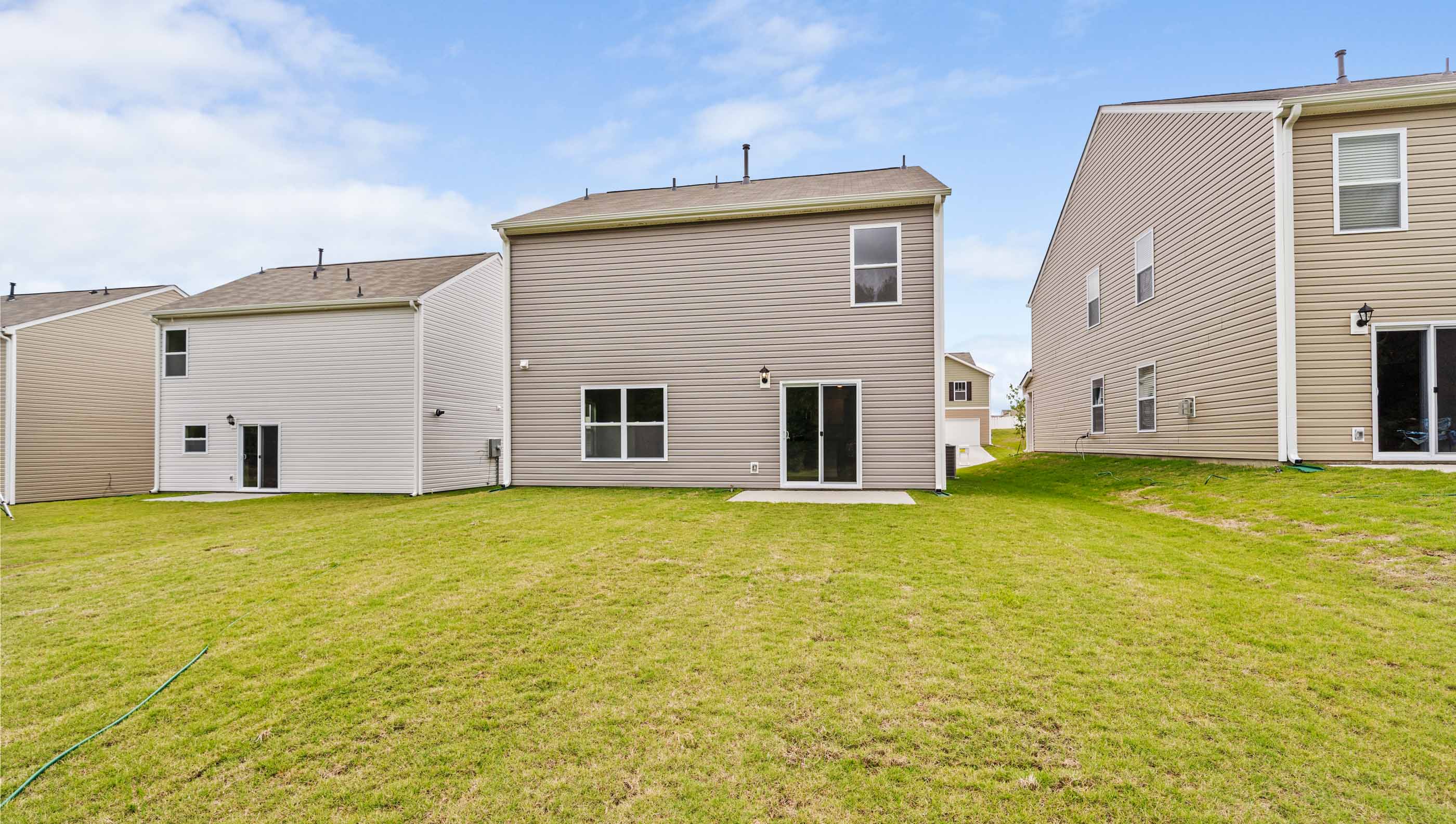 Back exterior with large backyard.
