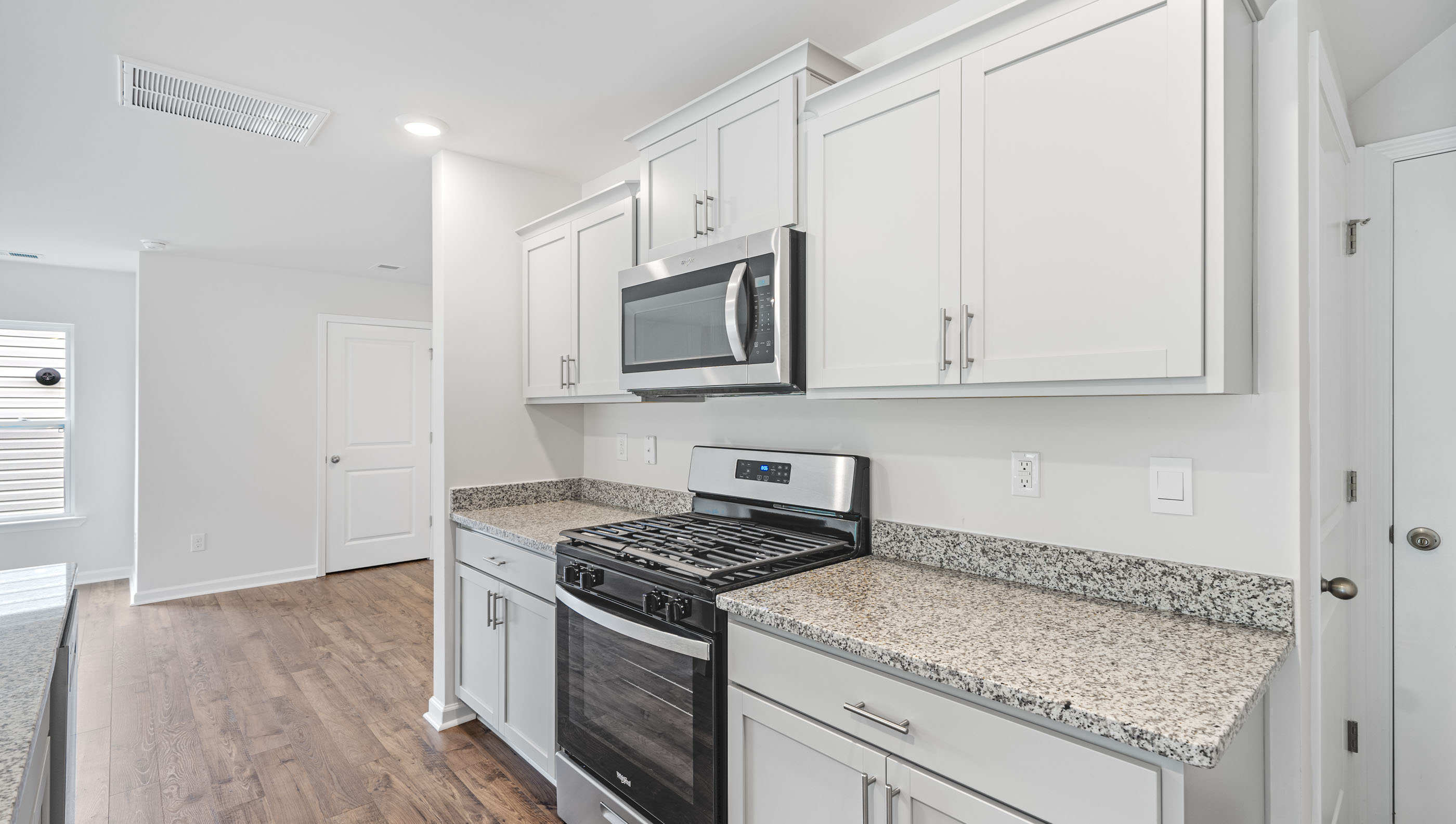 Kitchen with island and cabinets.
