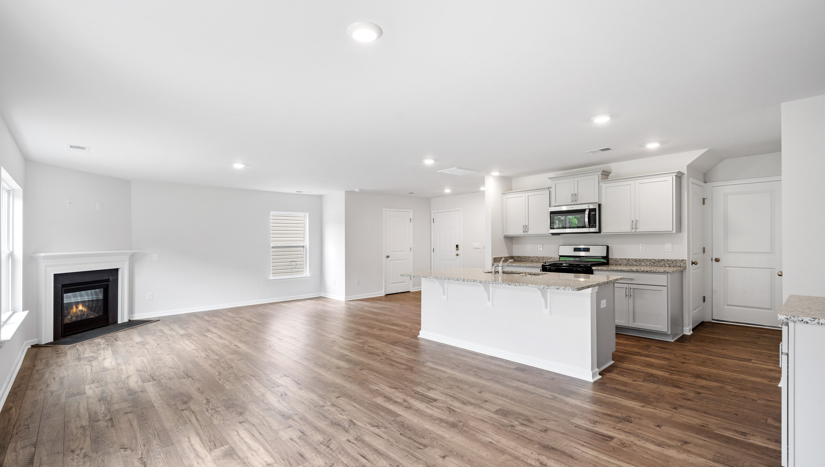 Kitchen with island and cabinets.