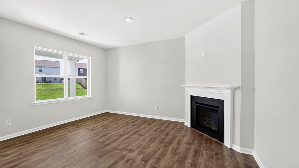 Living area with windows and fireplace.