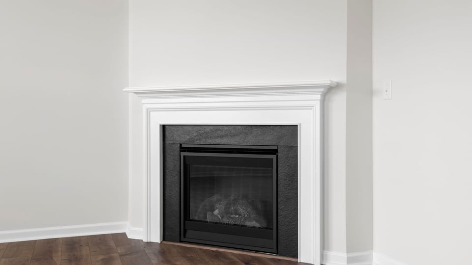 Living area with windows and fireplace.