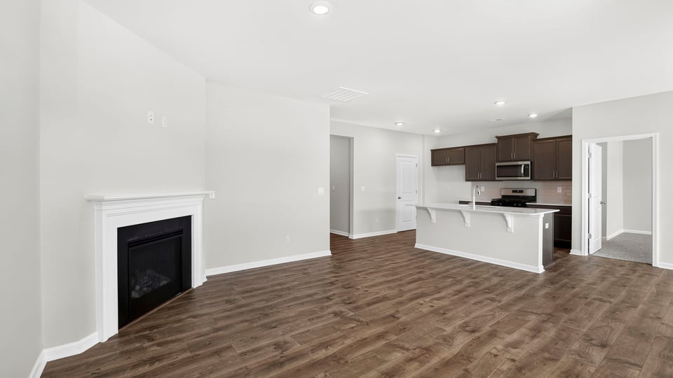 Living area with windows and fireplace.