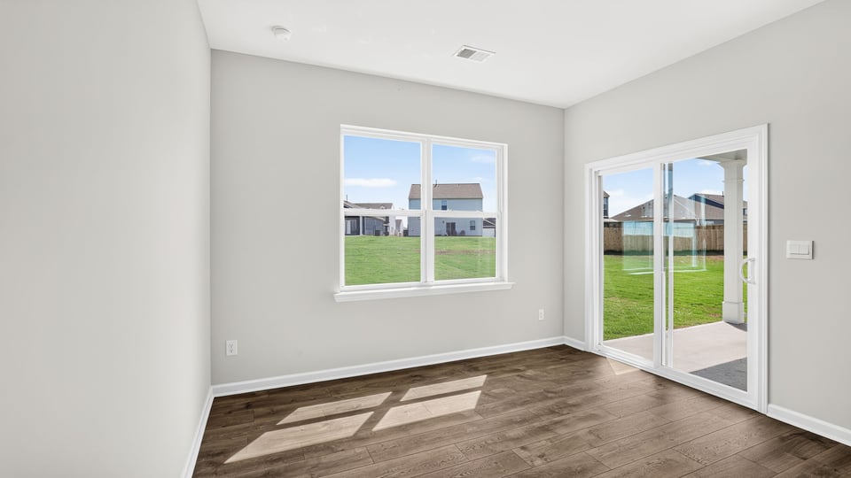Living area with windows and fireplace.