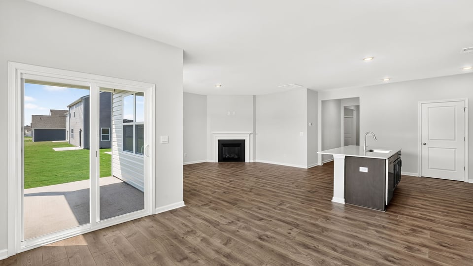 Living area with windows and fireplace.