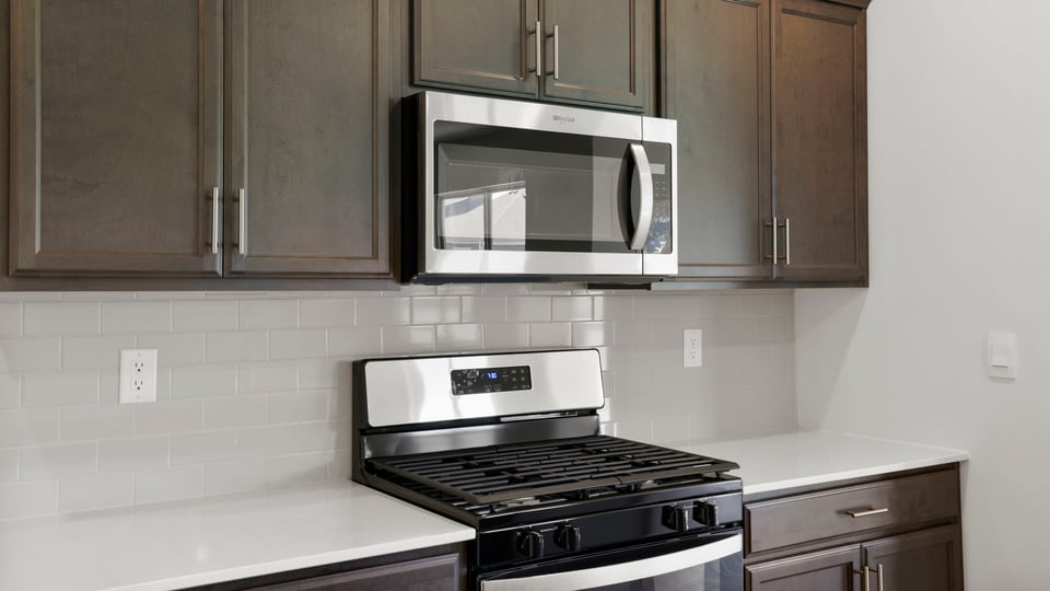 Kitchen with island and cabinets.
