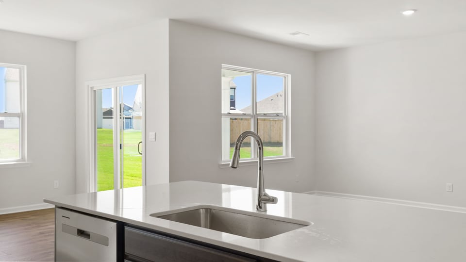 Kitchen with island and cabinets.