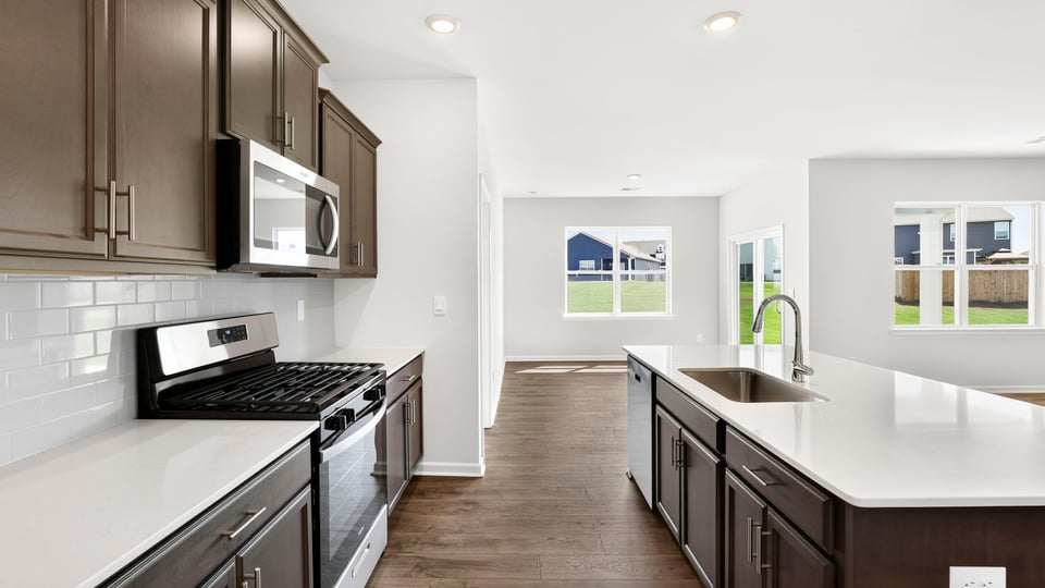 Kitchen with island and cabinets.