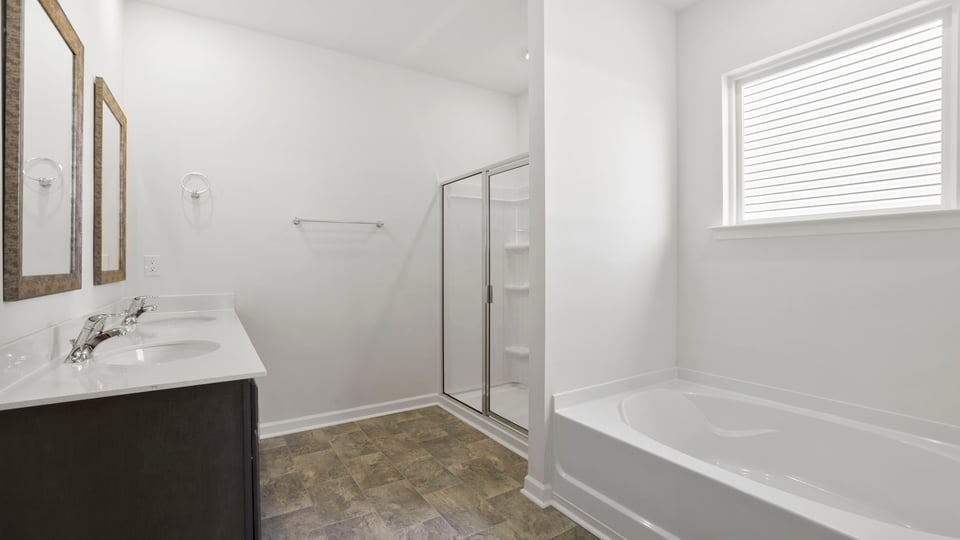Primary bathroom with double vanity sinks.
