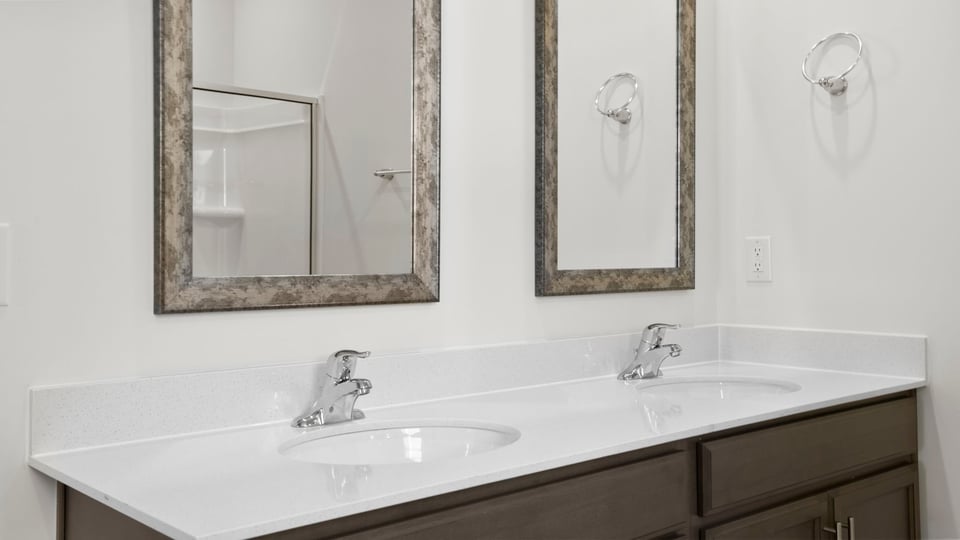 Primary bathroom with double vanity sinks.