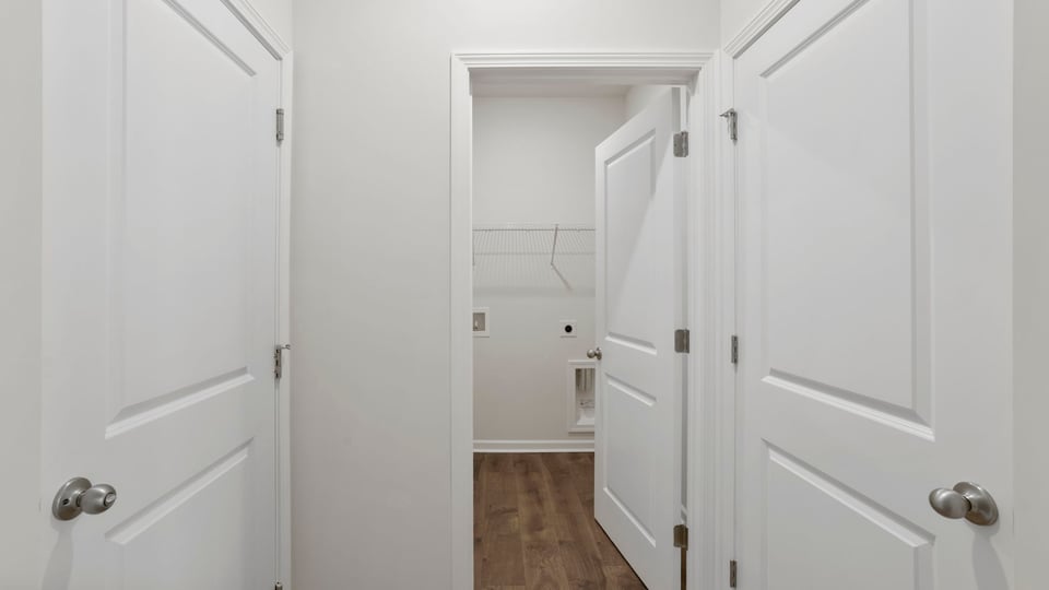 Primary closet with shelf.
